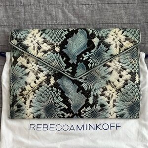 Rebecca Minkoff leather snake skin clutch with zipper detail with tags.